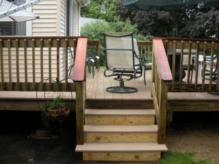 This is an image of a beautiful residential wood deck, custom built for the Central MA area by Solid State Construction.
