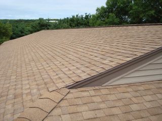 Completed asphalt shingle roof replacement by Solid State Construction