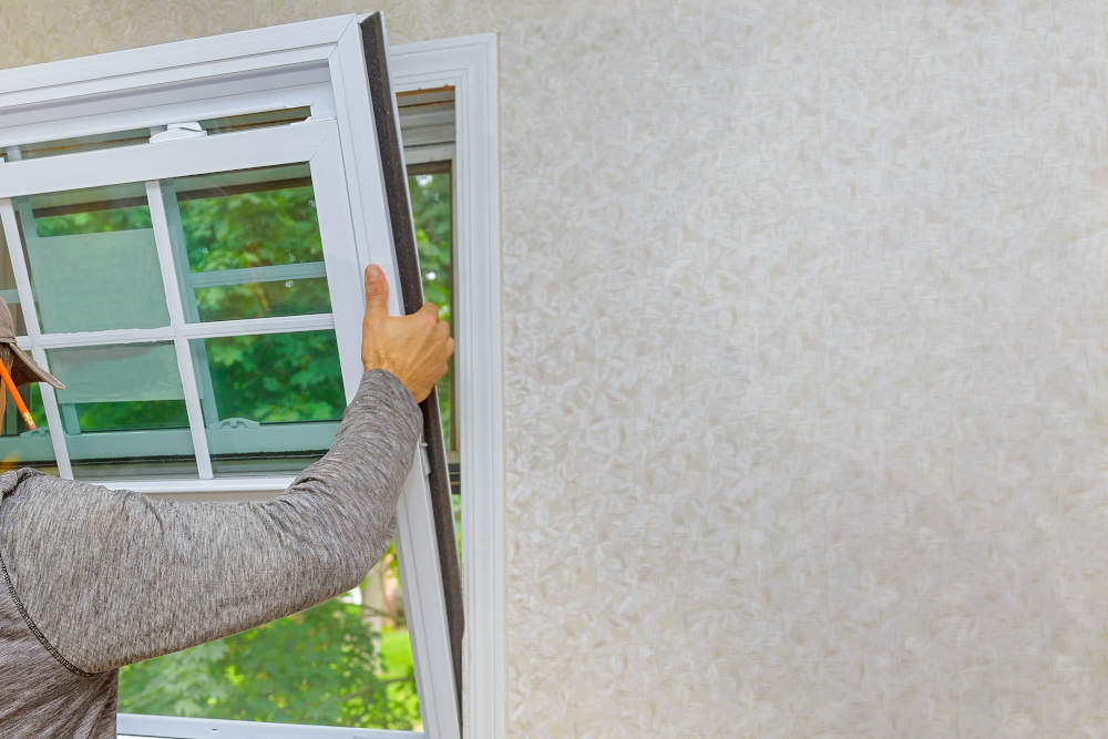 Worker in the installing new, windows 