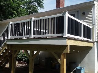 TimberTech AZEK Composite deck with white and black railing.