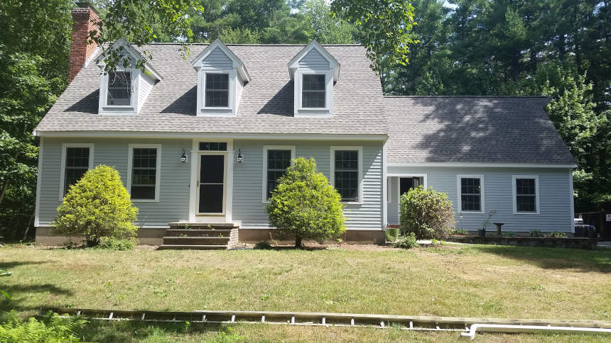 Two-Story Home With Beige James Hardie Siding, White Windows, And A New Roof