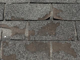 damaged asphalt roof