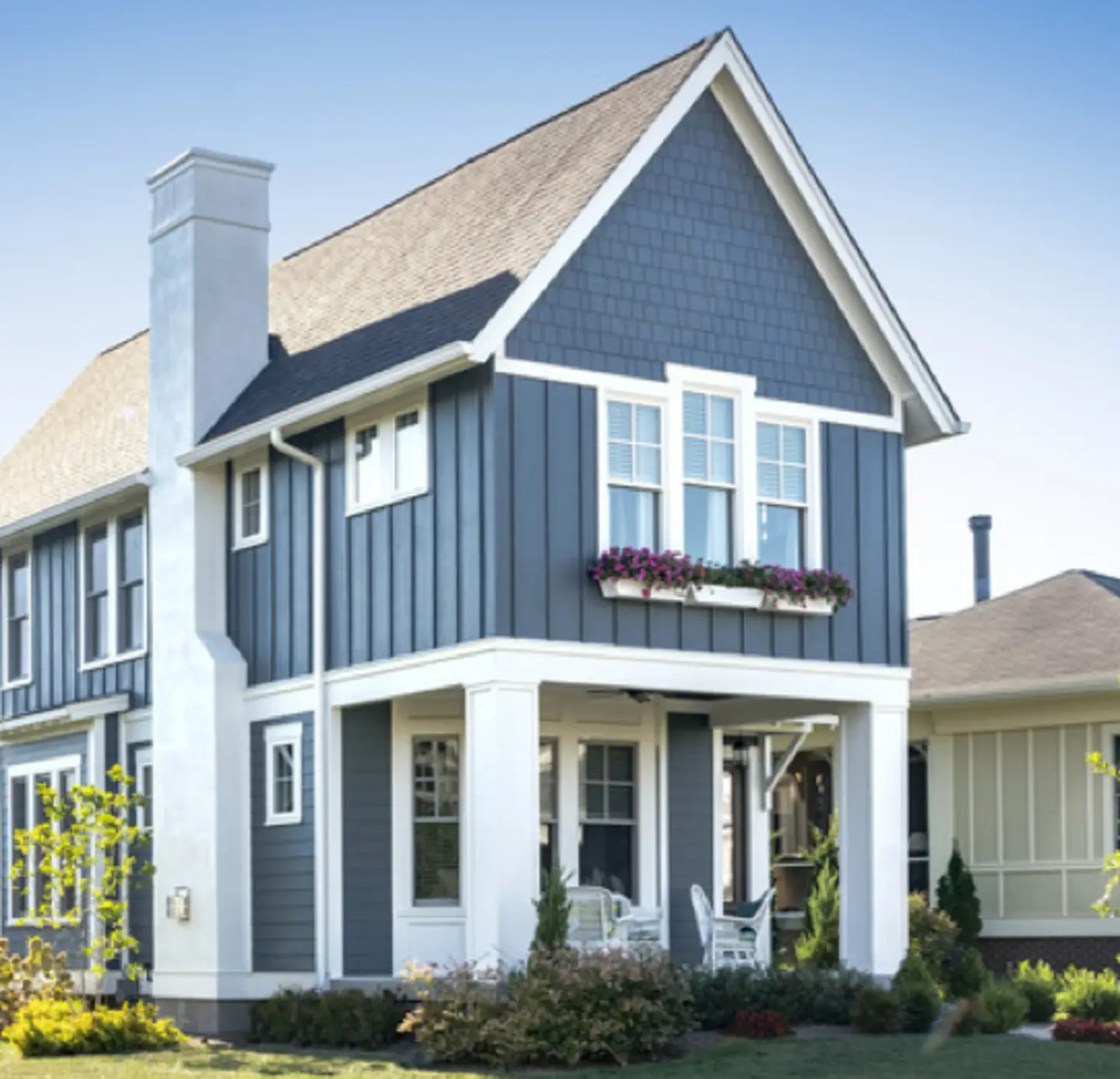 A beautiful james home with blue james hardie siding.